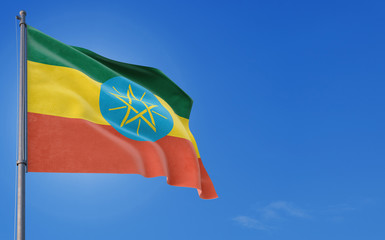 Ethiopia flag waving in the wind against deep blue sky. National theme, international concept. Copy space for text.