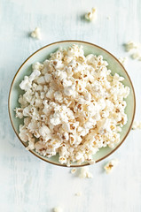 Bowl of fresh prepared popcorn. Top view. Copy space