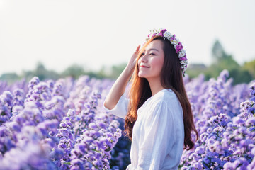 Portrait image of an asian woman in a beautiful Margaret flower field