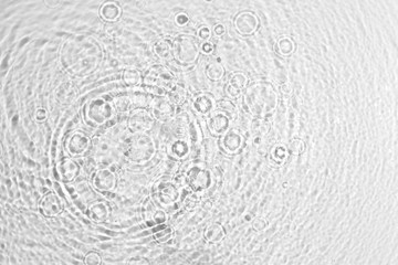 Fototapeta na wymiar texture of splashing clean water on gray background