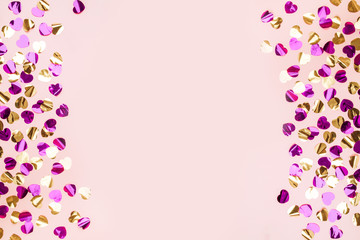 Colorful heart confetti on a background.