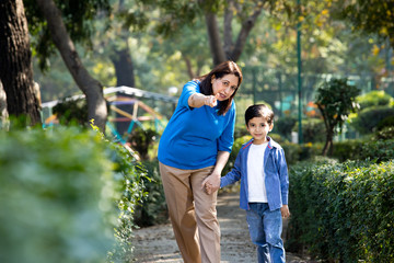 Cheerful grandmother spending leisure time with grandson