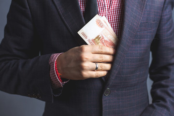 Married man in suit hides money