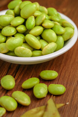 Edamame Beans Still lifeFresh boiled edamame beans isolated on wooden background
