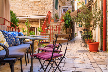 Fototapeta na wymiar Mediterranean summer cityscape - view of a medieval street in the Old Town of Split, the Adriatic coast of Croatia