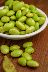 Edamame Beans Still lifeFresh boiled edamame beans isolated on wooden background