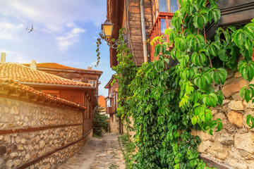 City landscape - view of the old streets and homes in balkan style, the Old Town of Nesebar, in Burgas Province on the Black Sea coast of Bulgaria