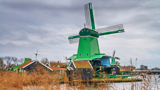 Rural landscape - view of the windmills on a cloudy winter day at the Zaanse Schan in the neighbourhood of Zaandam town, near Amsterdam, Netherlands
