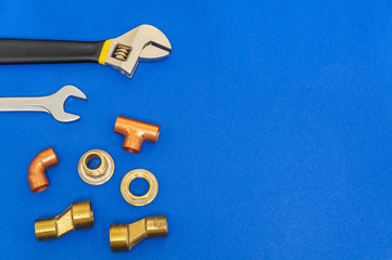 Set of tools for plumbing isolated on blue background with space for advertising