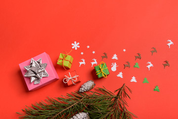 Christmas or New Year background, plain composition made of Xmas decorations and fir branches, flat lay, blank space for a greeting text