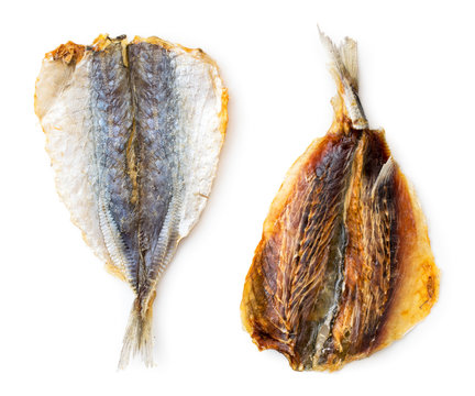 Dried yellow striped fish, selar close-up on a white background. Isolated, top view