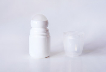 Mock up a bottle of deodorant with shadow. Front. Light background