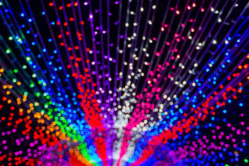 Blurry LED light tunnel on night for background.