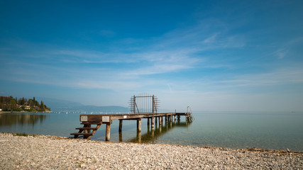 a jetty at lake Garda Italy