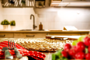 Kitchen vegetable chopping board with space for your product. Interior of fuzzy Italian kitchen furniture. White light from the lamp. Fresh vegetables and fruits.