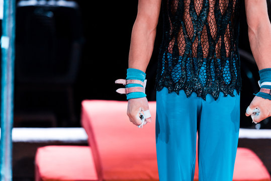 Cropped View Of Gymnast Standing With Clenched Fists In Circus