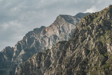 Obraz premium Mountain cliff close-up, clouds over the mountains,