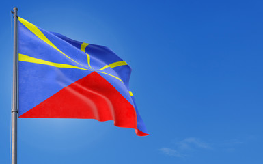 Reunion flag waving in the wind against deep blue sky. National theme, international concept. Copy space for text.