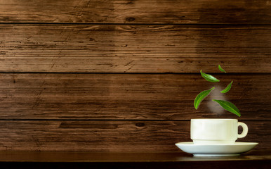  Coffee mugs and tea leaves on a wooden table