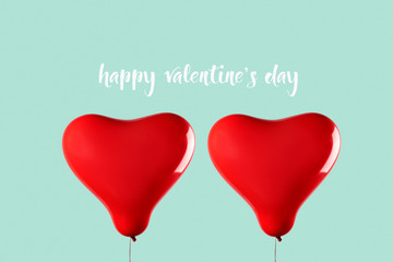 Obraz na płótnie Canvas heart-shaped balloons and text happy valentine day.
