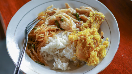 traditional indonesian culinary food. Nasi rames ayam dan telur traditional food from Indonesia.