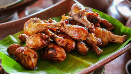 Traditional fried chicken from indonesia served on earthenware