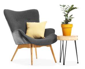 Fototapeta premium Modern armchair and table on white background