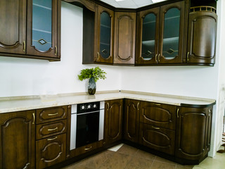 Contemporary modern fully fitted kitchen in brown with top spec appliances and granite worktops