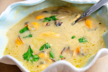 Traditional homemade greek mussels spicy soup cooked with olive oil and mustards