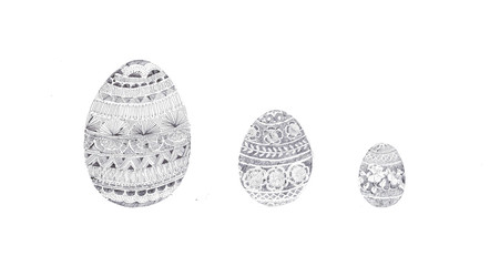 Easter Eggs. Three hand decorated ornate Easter eggs with traditional-style folklore wax batik design. Study, illustration, motif of beautiful filigree hand painted eggshells in Biro pen ballpoint pen