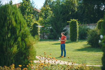 man working with drone at yard