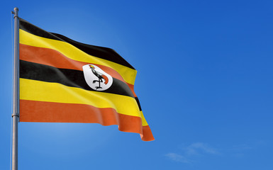 Uganda flag waving in the wind against deep blue sky. National theme, international concept. Copy space for text.