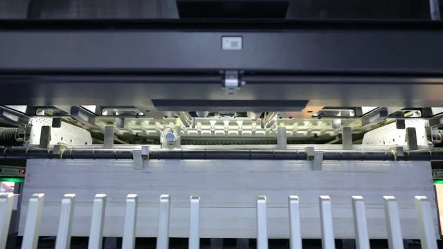 lose up of offset printing machines during production. Printing industry