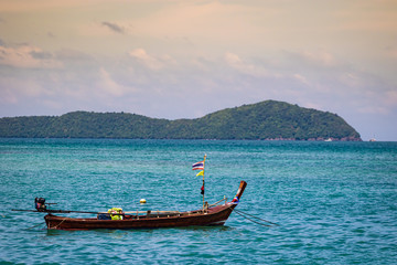 Obraz na płótnie Canvas Thai Longboat in Water