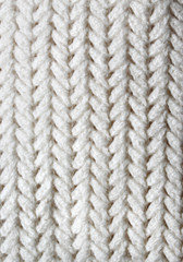 Knitting. Patterns. Natural yarn. Cotton. Wool. White and beige background.