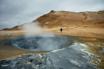 Bubbling geothermal hot mud pool in the Hverarond, Myvatn, Iceland.