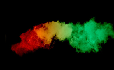 Colorful powder explosion on black background. Colored cloud. Colorful dust explode. Paint Holi.
