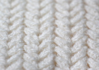 Knitting. Patterns. Natural yarn. Cotton. Wool. White and beige background.