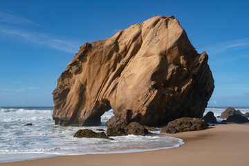 Fototapeta na wymiar Praia de Santa Cruz beach rock boulder, in Torres Vedras, Portugal