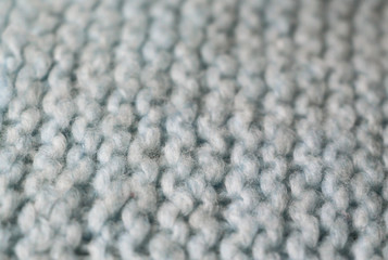 Knitting. Patterns. Natural yarn. Cotton. Wool. White and blue background.