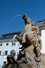 Fototapeta na wymiar Caesar's fountain ( Caeasarova fontana ), Upper Square ( Horni namesti ), Olomouc, Czech Republic / Czechia - baroque sculpture from 18th century. Equestrian statue. Shallow depth of field.