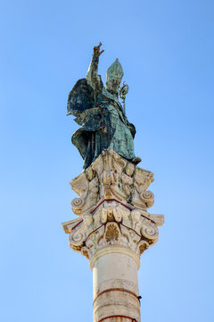 Close-up of the Column of Sant'Oronzo, patron saint of the city of Lecce, in Salento, Puglia, Italy. The statue is positioned in the main square of Lecce
