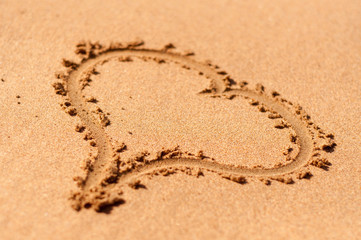 The heart at the beach. Selective focus.