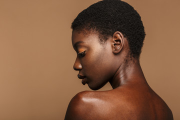 Beauty portrait of young half-naked african woman with short black hair