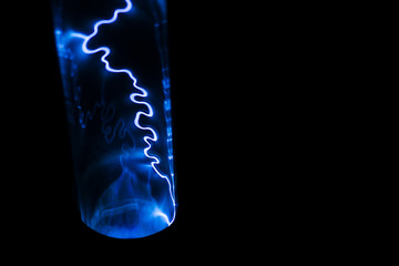 Lightning blue on a black background. Natural magic light effect. Abstract electric shock. Energy...