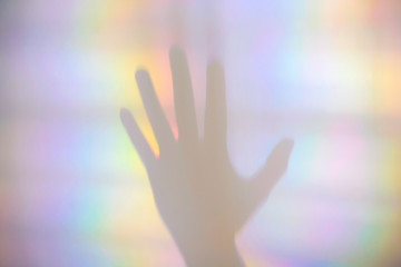 Colorful prism rainbow light and shadow of a hand - Powered by Adobe