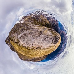 Aerial tiny planet on top of mountain
