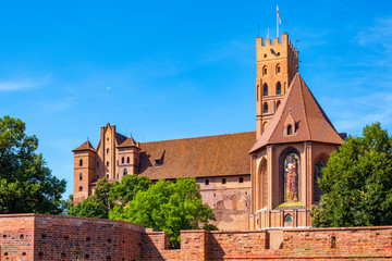 Panoramic view of the medieval Teutonic Order Castle in Malbork, Poland - High Castle and St. Mary church