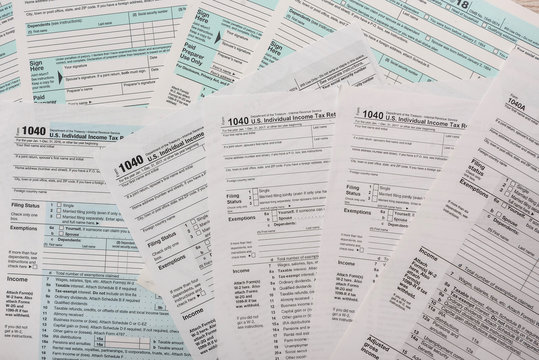 many 1040 tax form. Tax concept.