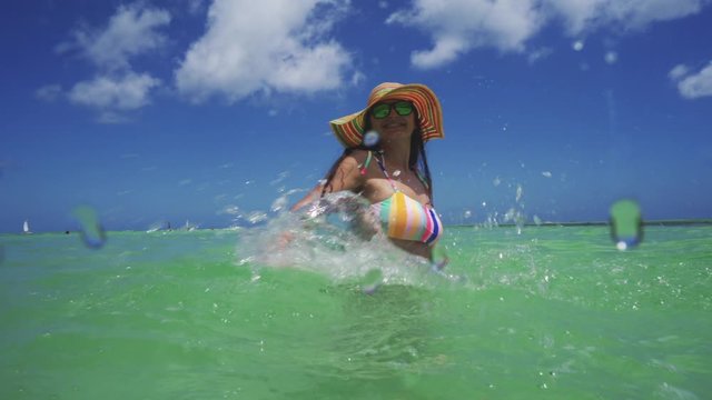 Happy woman and Caribbean sea, Punta Cana, Dominican Republic. Summer holiday. Follow me concept.